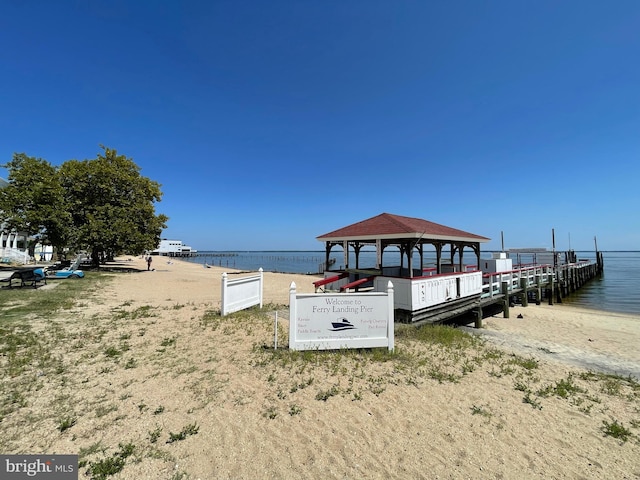 dock area with a gazebo and a water view