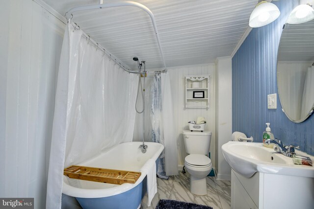 full bathroom with toilet, tile patterned flooring, shower / bath combo with shower curtain, vanity, and crown molding