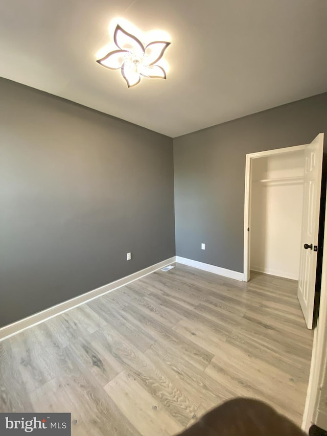 spare room featuring hardwood / wood-style floors