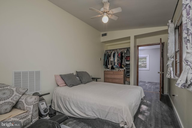 bedroom featuring ceiling fan and a closet