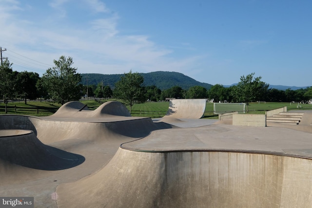 view of swimming pool with a mountain view