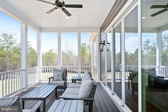 sunroom / solarium featuring ceiling fan and a wealth of natural light