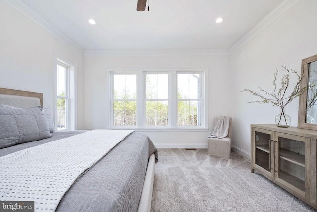 bedroom featuring crown molding, carpet flooring, and ceiling fan