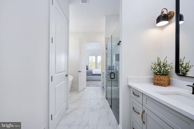 bathroom with vanity and an enclosed shower