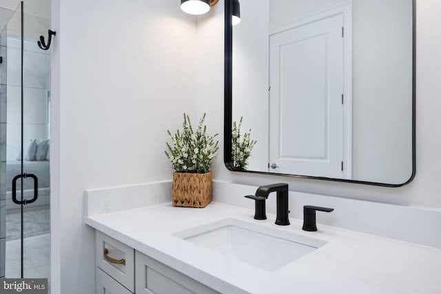 bathroom with vanity and an enclosed shower