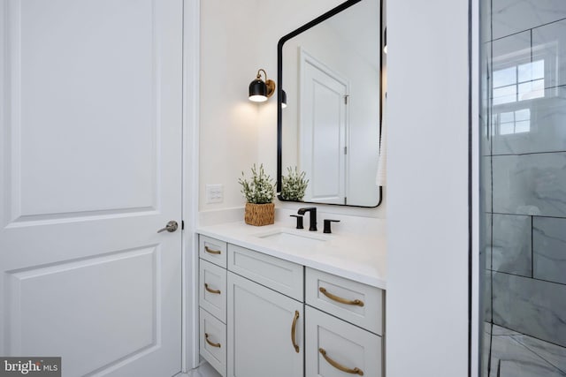 bathroom with vanity and a shower