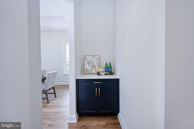 hallway with light hardwood / wood-style flooring