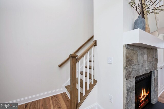 stairs with wood-type flooring