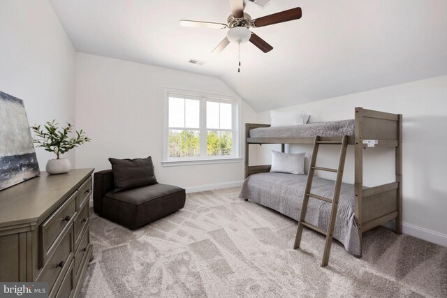 carpeted bedroom featuring ceiling fan and lofted ceiling