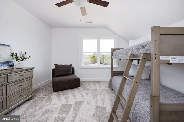 carpeted bedroom featuring ceiling fan and lofted ceiling