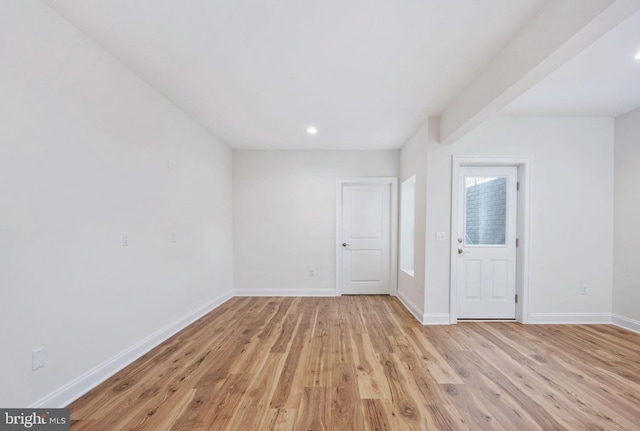 unfurnished room featuring light hardwood / wood-style floors