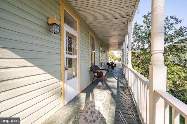 wooden deck featuring covered porch