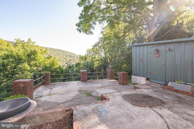 view of patio with a mountain view