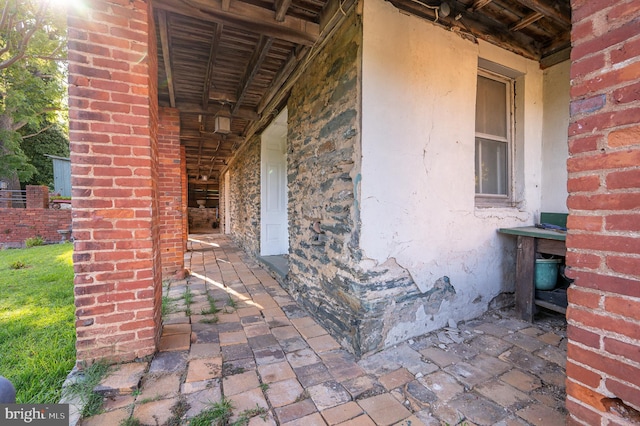 exterior space featuring brick siding