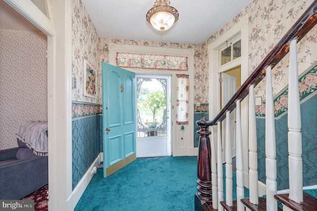 view of carpeted entrance foyer