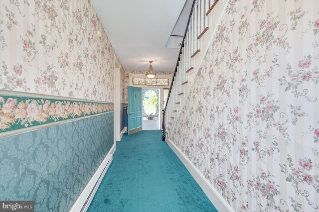 hallway with stairs, baseboards, carpet flooring, and wallpapered walls