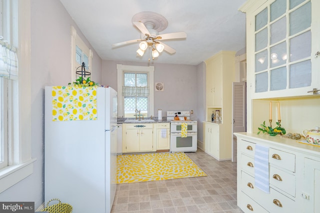 kitchen with ceiling fan, sink, white appliances, and light tile patterned flooring