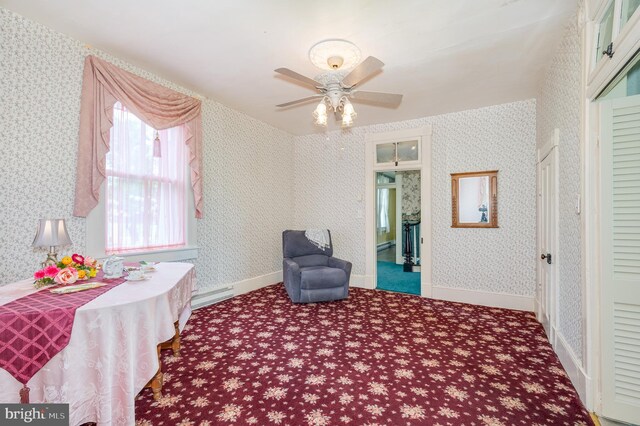 interior space featuring ceiling fan and carpet flooring