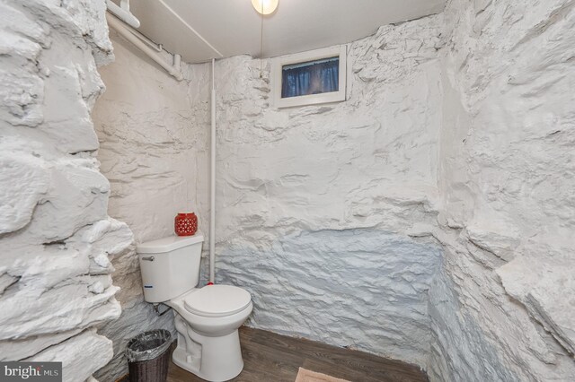 bathroom featuring toilet and hardwood / wood-style floors