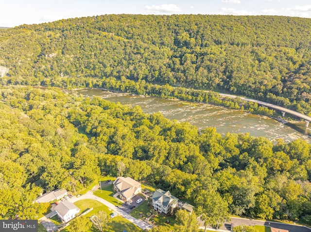 drone / aerial view with a view of trees