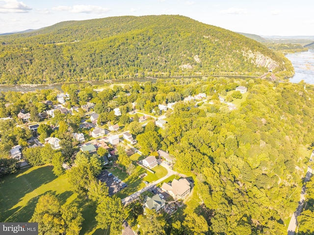 aerial view with a residential view, a mountain view, and a wooded view