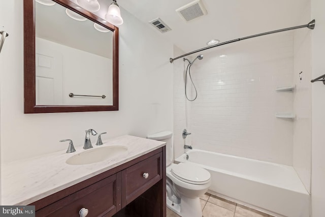 full bathroom featuring tiled shower / bath, vanity, toilet, and tile patterned floors