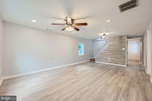 unfurnished living room featuring light wood-type flooring and ceiling fan