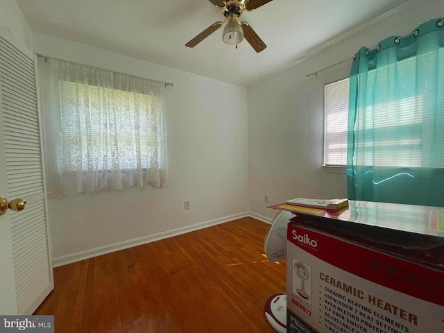 interior space with ceiling fan and hardwood / wood-style floors