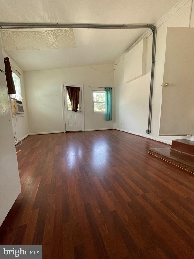 unfurnished living room featuring cooling unit and dark hardwood / wood-style flooring