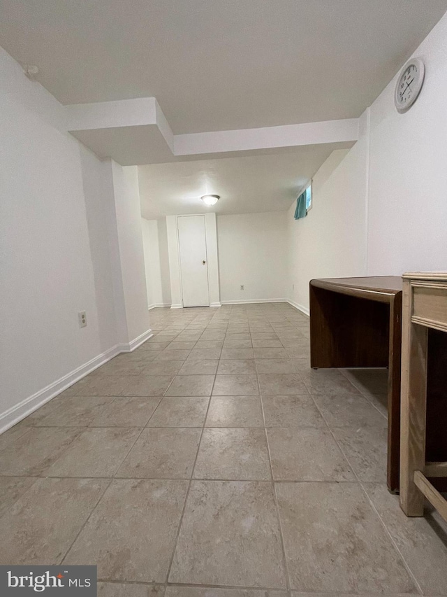 basement with light tile patterned floors