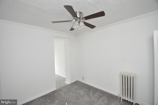 unfurnished room featuring radiator heating unit, carpet, crown molding, a textured ceiling, and ceiling fan