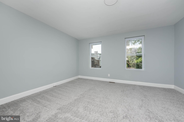 unfurnished room featuring carpet floors