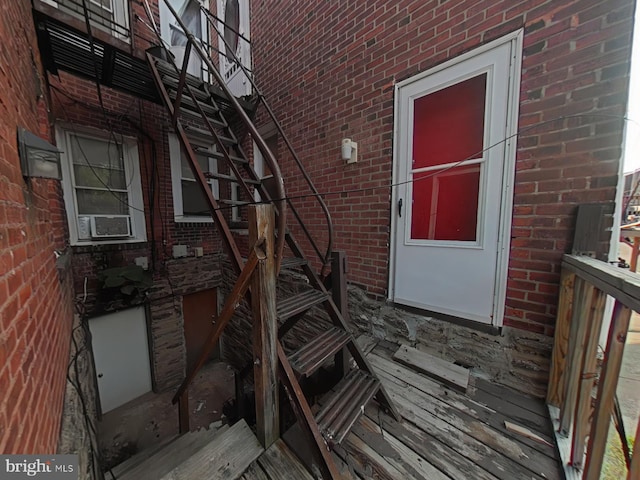 property entrance with brick siding