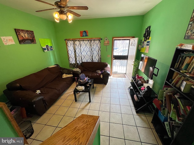 tiled living room featuring ceiling fan