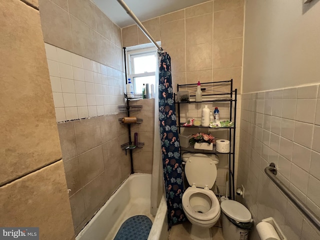 bathroom featuring tile walls, shower / tub combo with curtain, and toilet