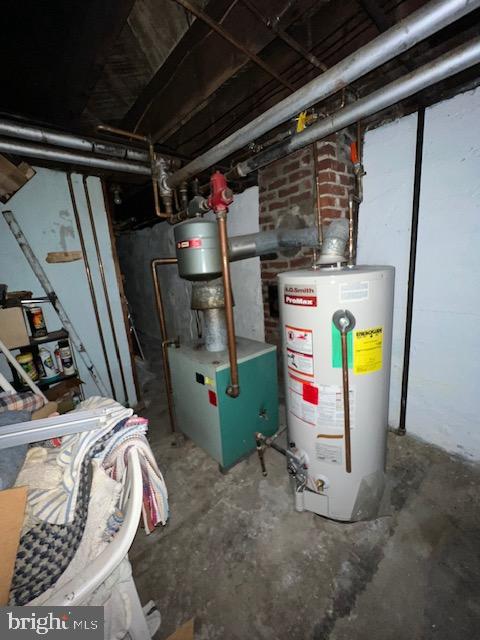 utility room with water heater