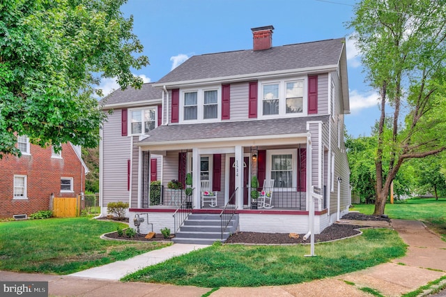 view of front of property with a front lawn and a porch