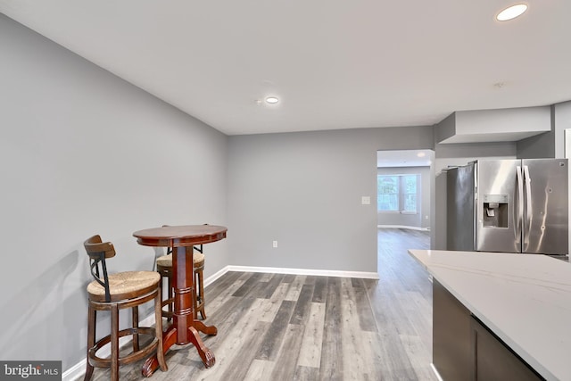 dining area with hardwood / wood-style floors