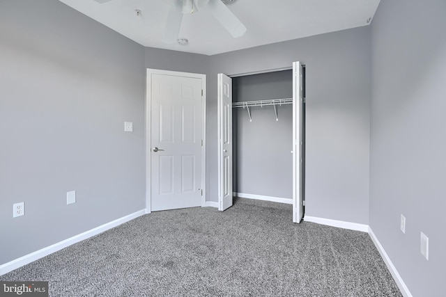 unfurnished bedroom featuring carpet flooring, ceiling fan, and a closet