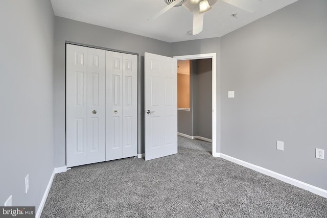 unfurnished bedroom with ceiling fan, carpet, and a closet