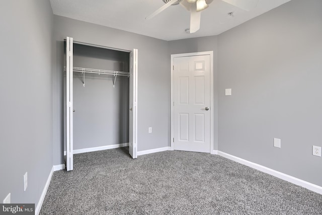 unfurnished bedroom with ceiling fan, a closet, and carpet