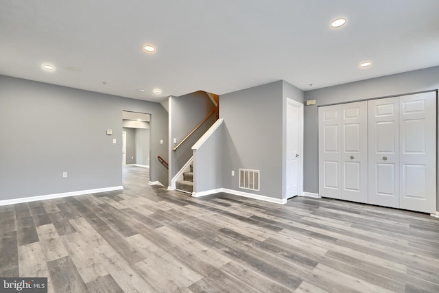 interior space featuring wood-type flooring and a closet