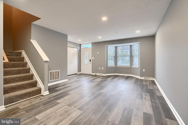 unfurnished living room featuring hardwood / wood-style floors