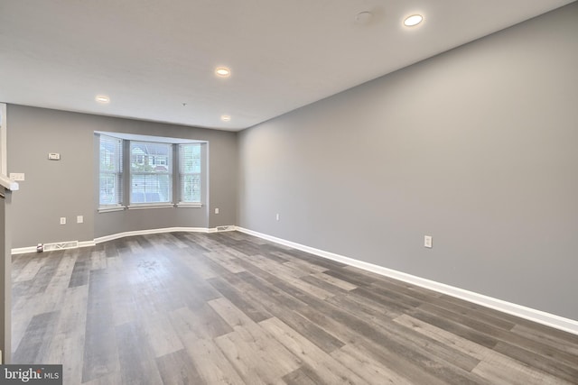 spare room featuring hardwood / wood-style flooring