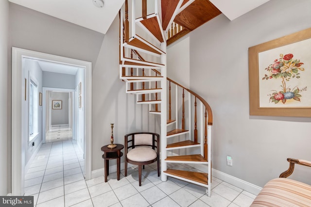 stairway with tile patterned flooring