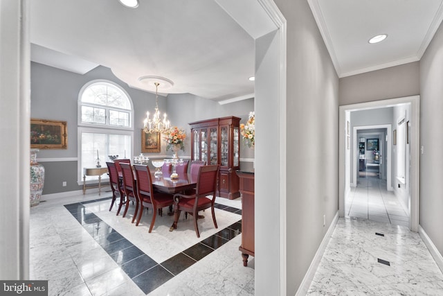 dining area with crown molding and a chandelier