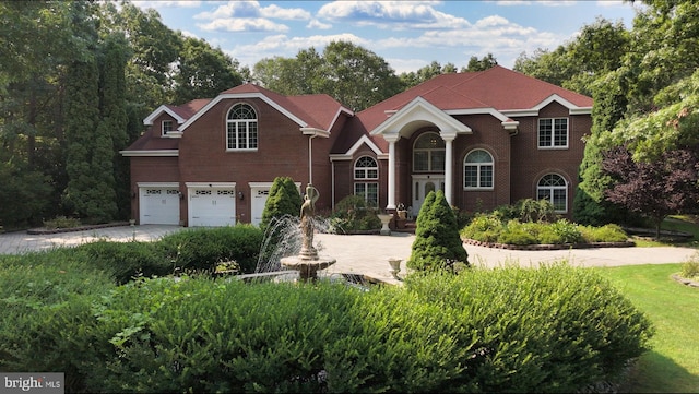 view of front of property with a garage