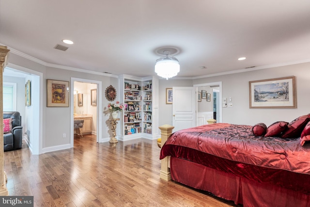 bedroom featuring wood-type flooring, connected bathroom, and ornamental molding