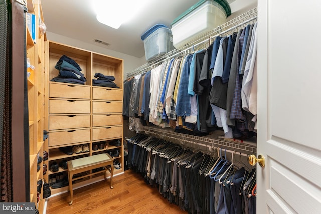 walk in closet featuring hardwood / wood-style flooring