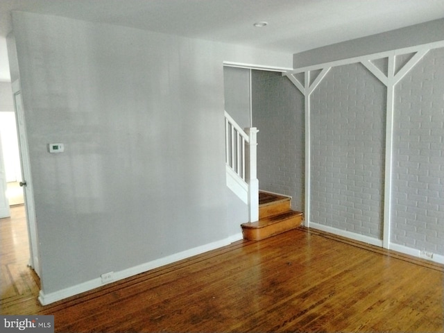 spare room with hardwood / wood-style floors